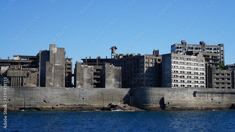 Gunkanjima is an abandoned city of a coal miners on the Hashima island in Japan. Panoramic view.