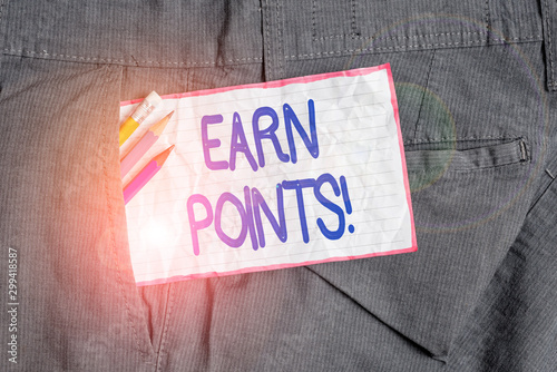 Text sign showing Earn Points. Business photo text collecting scores in order qualify to win big prize Writing equipment and white note paper inside pocket of man work trousers