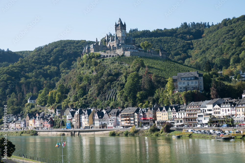 The beautiful Reichsburg Cochem (Cochem Imperial Castle) with village and the river Moselle in the foreground, Cochem, Rhineland-Palatinate, Germany, Europe