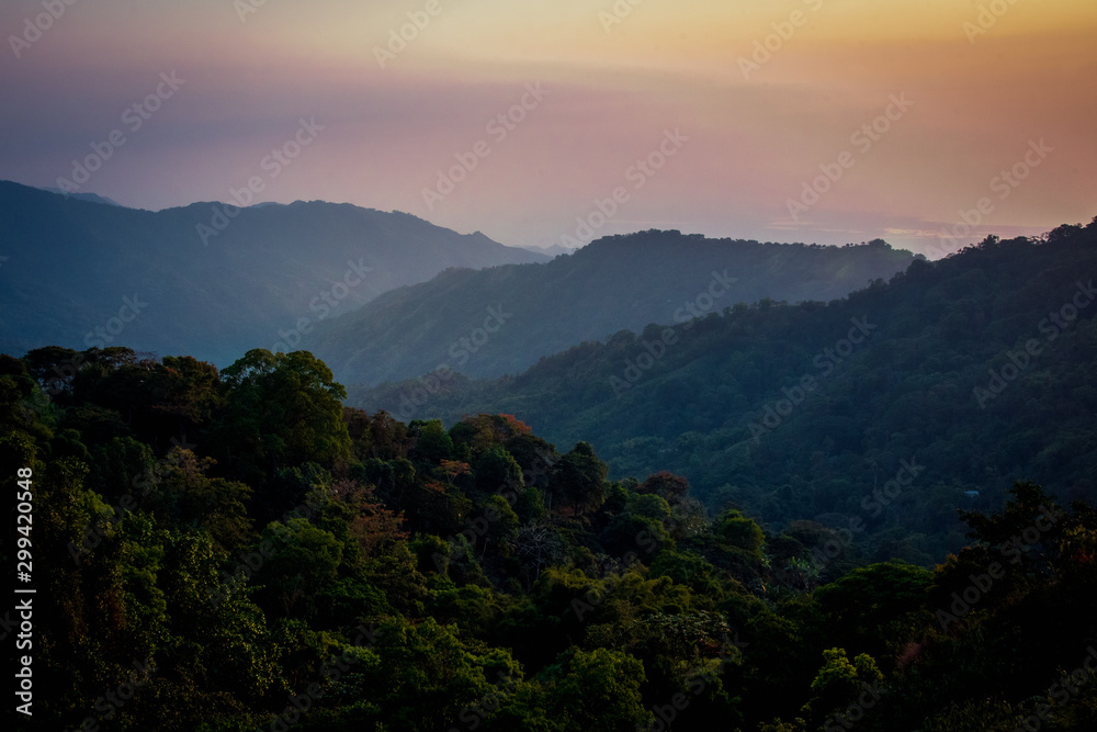 Obraz premium Lush Purple and orange Sunset over the hills in Colombia