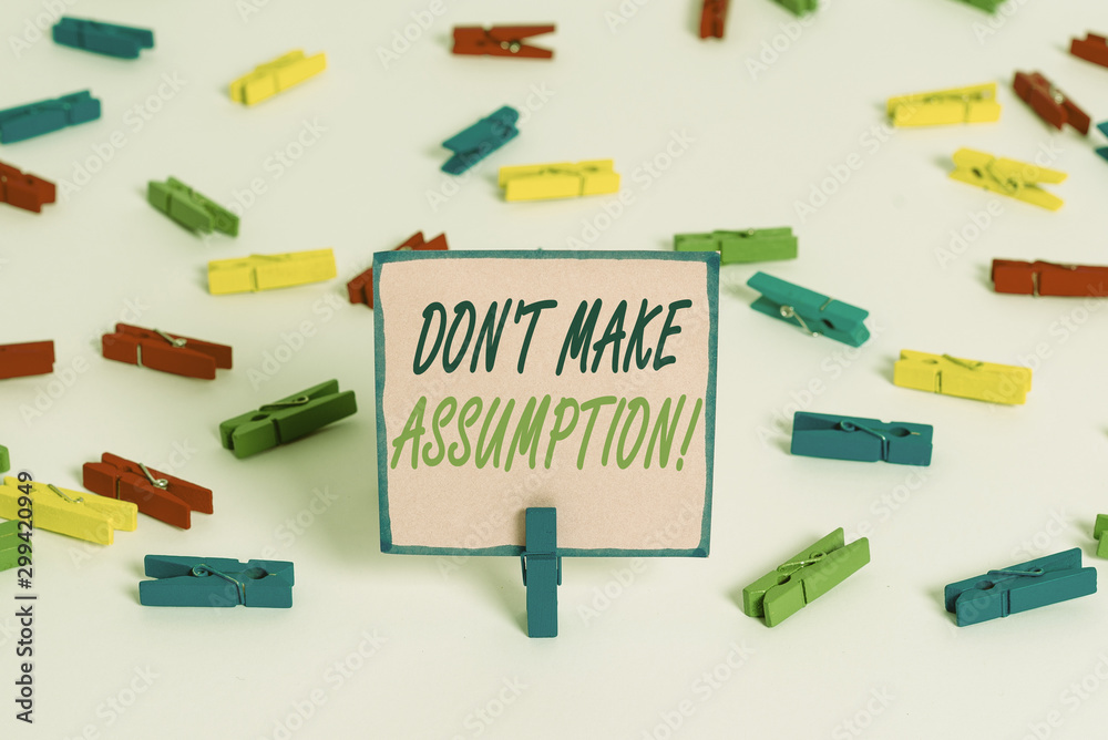 Text sign showing Don T Make Assumption. Business photo text something that you assume to be case even without proof Colored clothespin papers empty reminder white floor background office Text sign showing Don T Make Assumption. Business photo text something that you assume to be case even without proof Colored clothespin papers empty reminder white floor background office