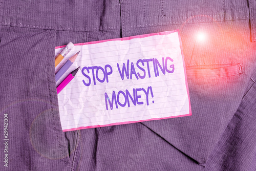 Text sign showing Stop Wasting Money. Business photo text advicing demonstrating or group to start saving and use it wisely Writing equipment and white note paper inside pocket of man work trousers