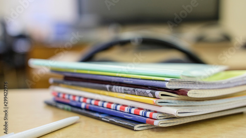 image of a stack of notebooks on the teacher's desk © Dmitry Vereshchagin