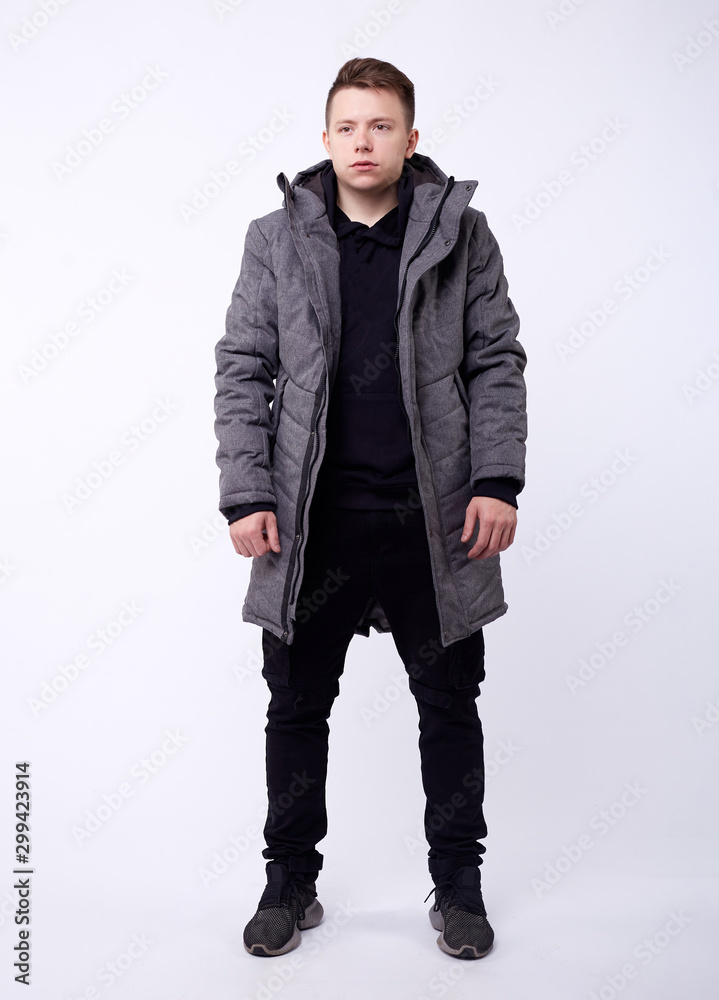 A man stand up wearing gray jacket isolated white at the studio. A man stand up wearing gray jacket isolated white at the studio.