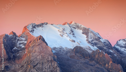 Colorful sunrise over Marmolada Peak - 3343meters, the highest mountain in the Dolomites, Italy