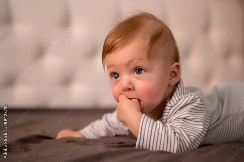 baby boy 3 months lying on his stomach at home baby boy 3 months lying on his stomach at home