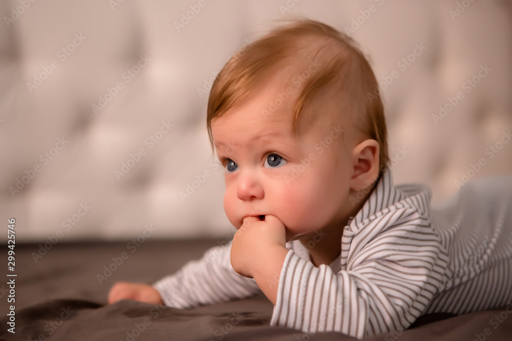 baby boy 3 months lying on his stomach at home baby boy 3 months lying on his stomach at home