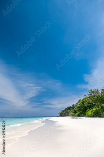 White sand beach  clear water  deep blue sky in the tropical sea of       Thailand.