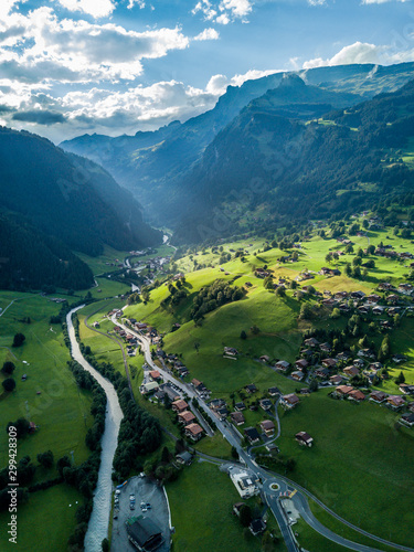Sun shines over Swiss village Grindelwald after heavy storm in summer time near Swiss Alps