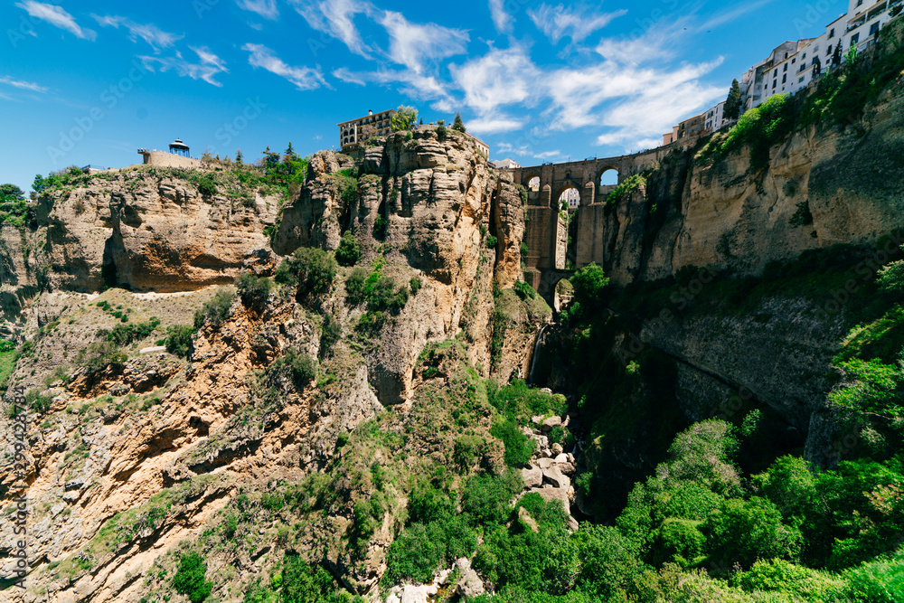 ronda. scenery. marvelous view of an old building entwined with plants ronda. scenery. marvelous view of an old building entwined with plants