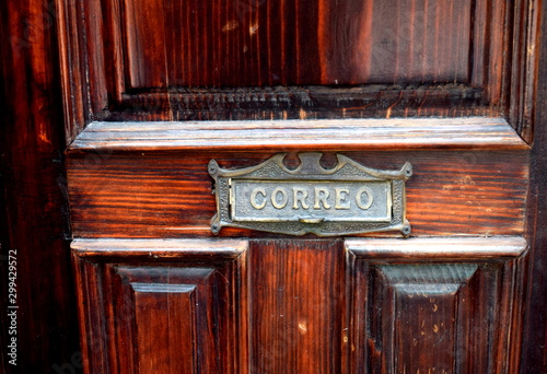 Old door with mail slot in Mexico