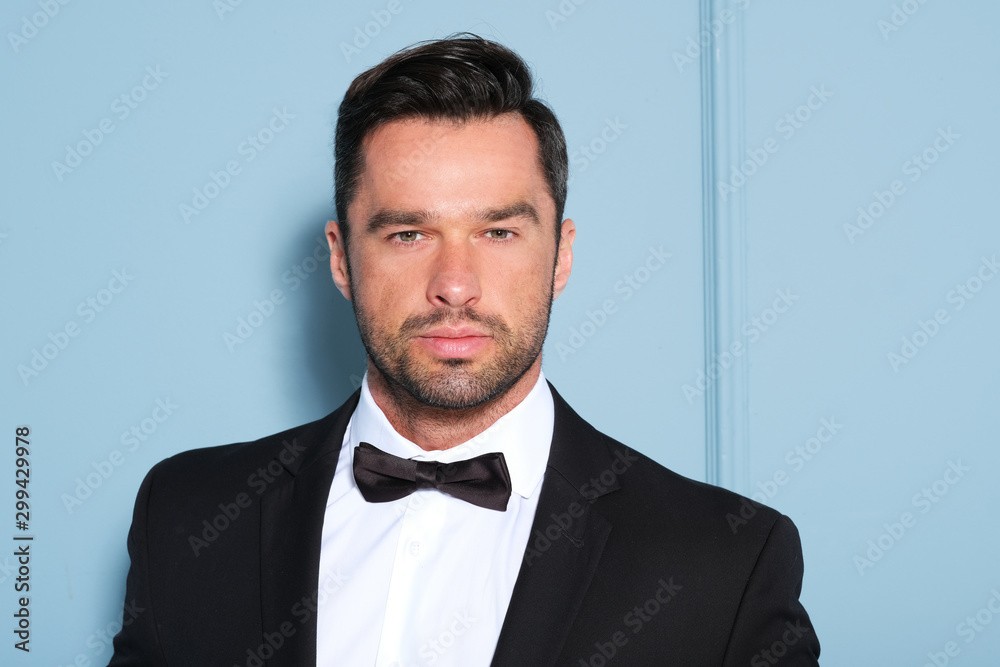 Handsome brunete model in perfectly fitting black classic suit. Handsome brunete model in perfectly fitting black classic suit.