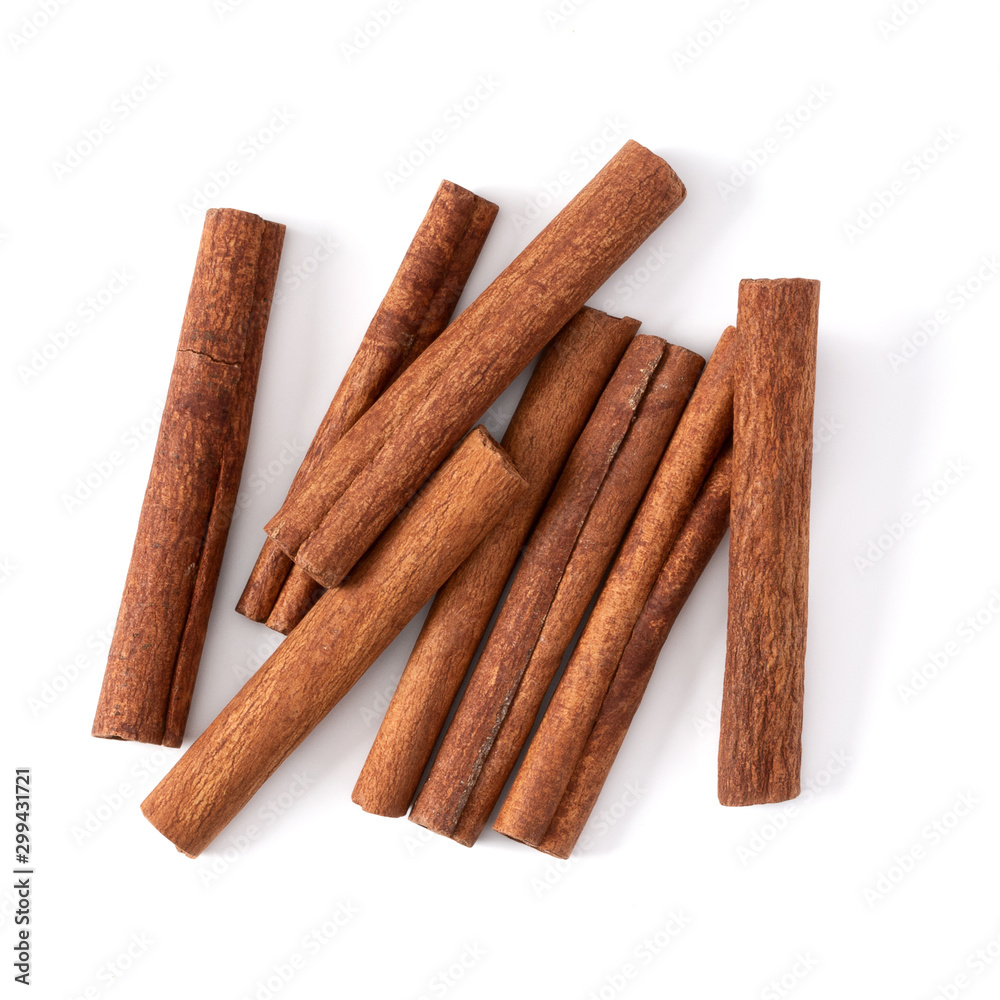 Cinnamon sticks isolated on white background closeup. Canella spice. Aromatic condiment background. Flat lay, top view. Cinnamon sticks isolated on white background closeup. Canella spice. Aromatic condiment background. Flat lay, top view.