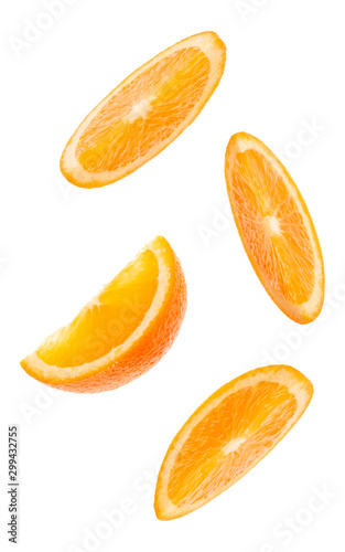 falling fresh orange fruit slices isolated on white background closeup. Flying food concept. Top view. Flat lay. Orange slice in air, without shadow.