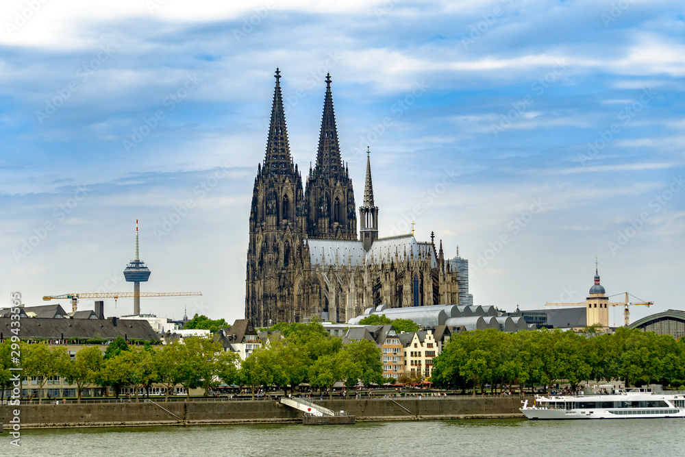 The Cologne Cathedral from the other side of the Rhine with TV Tower in the background in Cologne Germany