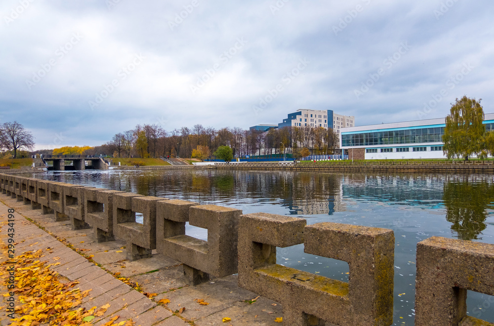 Svisloch river and autumn cityscape of district Nyamiha in downtown Minsk, Belarus