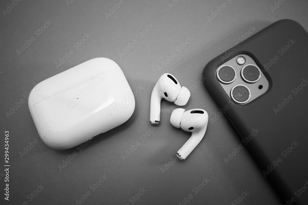 Paris, France - Oct 30, 2019: Charging case and the new iPhone 11 Pro next  to New Apple Computers AirPods Pro headphones with Active Noise  Cancellation for immersive sound Photos | Adobe Stock