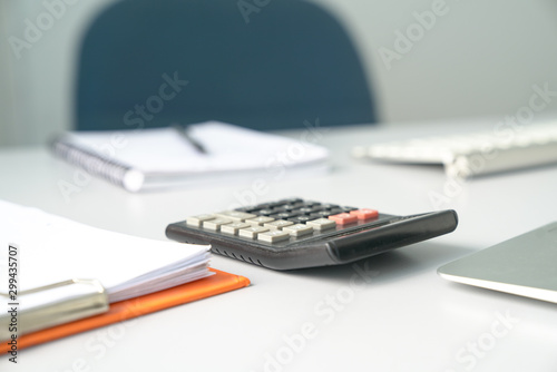 View of an Accountant's office table, focus on calculator