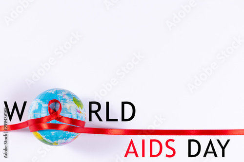 Aids sign, Red ribbon wrapped around the globe. World Aids Day concept