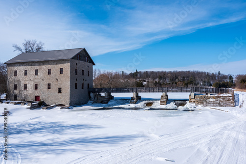 winter landscape with old mill and snow