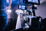 Behind the scenes of filming films or video products and the film crew of the film crew on the set in the pavilion of the film studio.