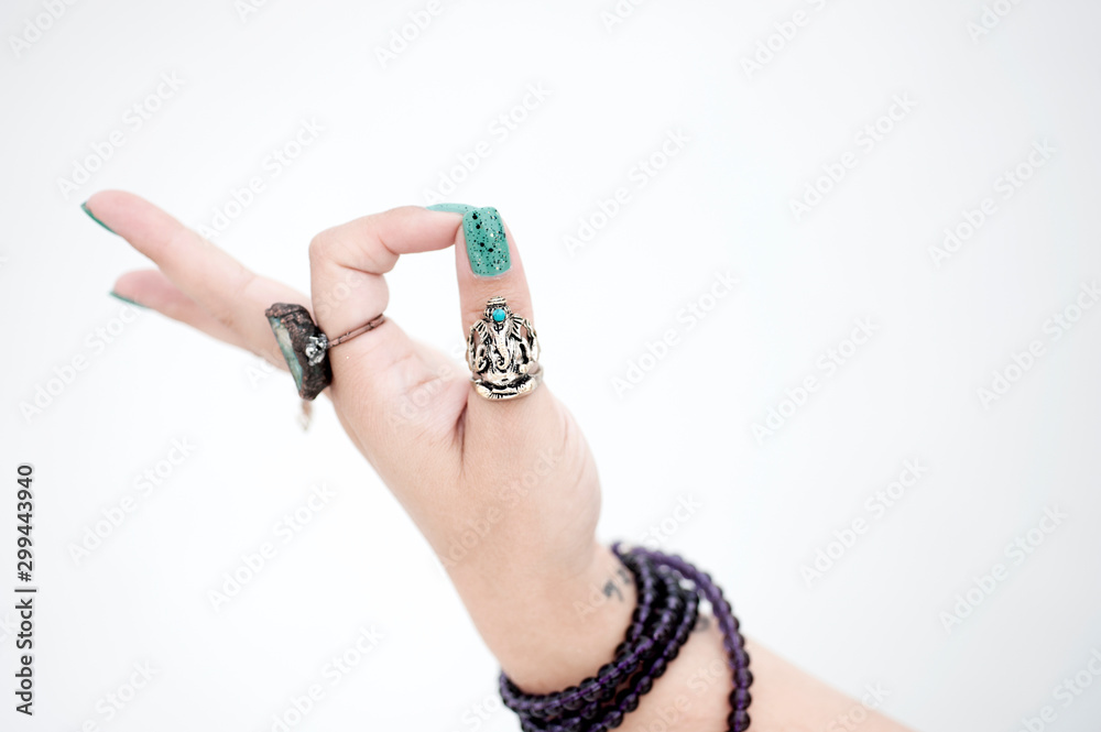 A woman's hand in a yoga mudra pose. A woman's hand in a yoga mudra pose.