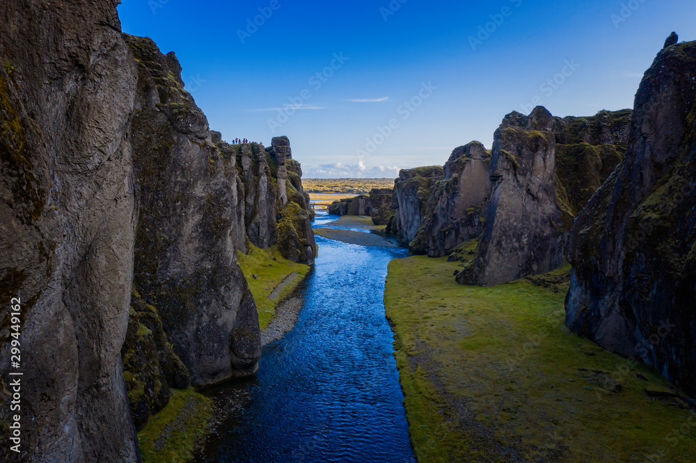 The most picturesque canyon Fjadrargljufur and the shallow creek, which flows along the bottom of the canyon. Fantastic country Iceland. September 2019. aerial drone shot