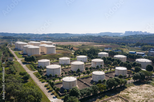 Aerial view and skyline view of large storage tanks in urban factory area