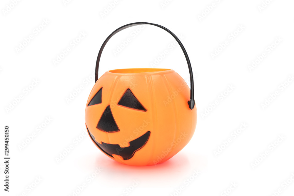 Fototapeta premium Halloween props cute plastic pumpkin head basket toy close-up isolated on white background