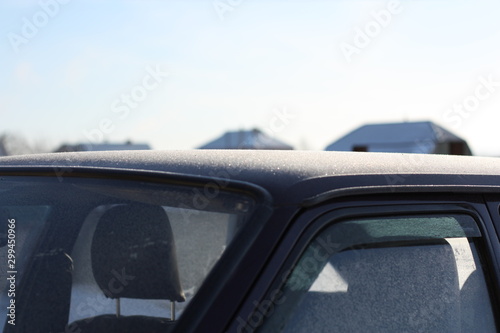 Car interior in winter.  Frozen winter car outdoor. © epovdima