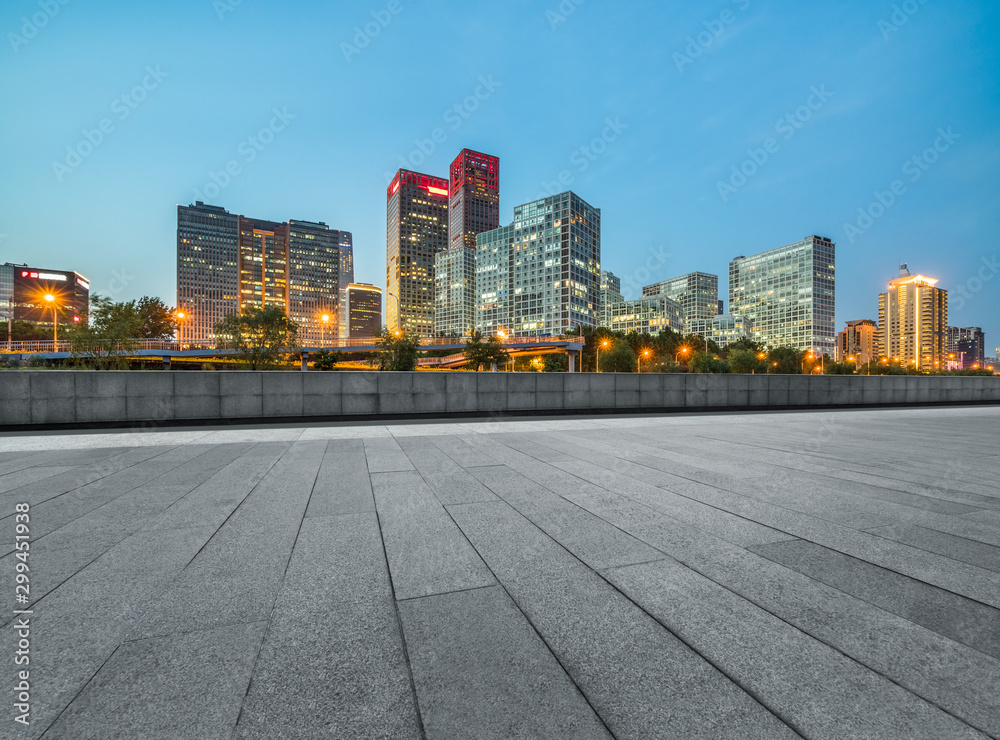 Empty city square road and modern business district office buildings in Beijing at night, China