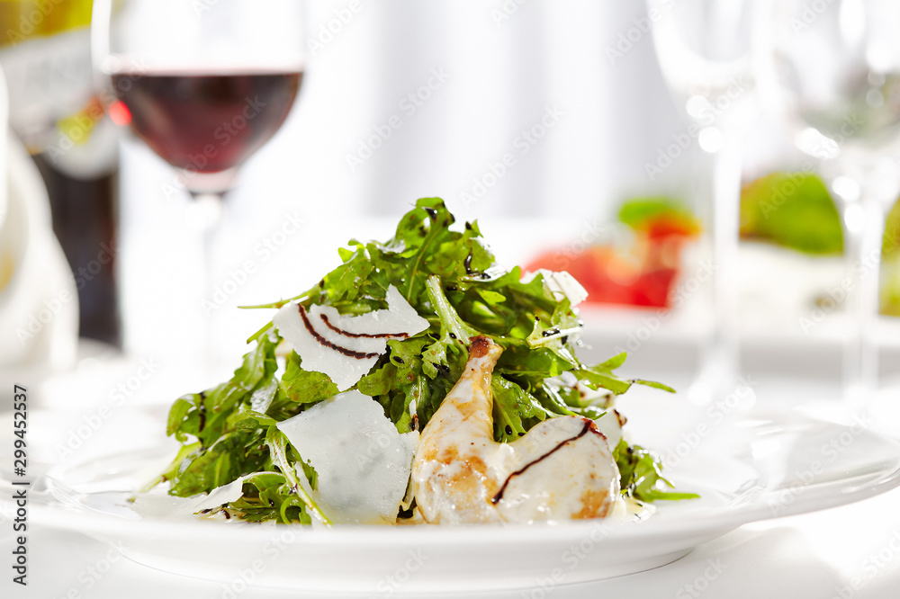 Gourmet, restaurant, delicious dinner food - close up of Salad with Quail Wings and Parmesan Cheese Gourmet, restaurant, delicious dinner food - close up of Salad with Quail Wings and Parmesan Cheese
