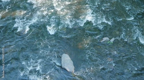 Water flows over stones in Wissahickon Creek photo