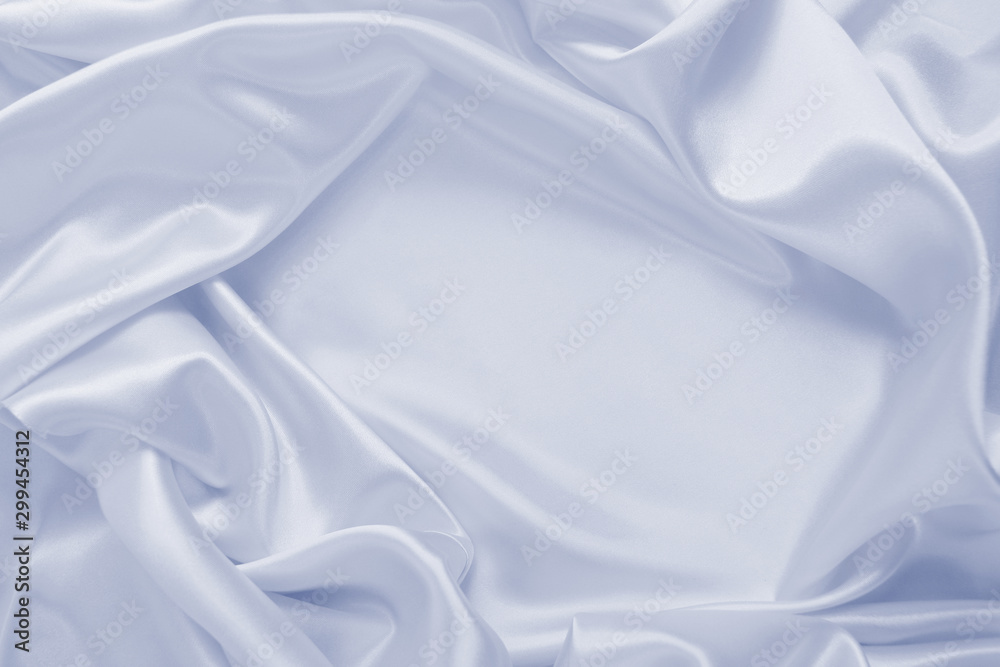 Obraz premium Delicate satin draped fabric of blue color texture for festive backgrounds