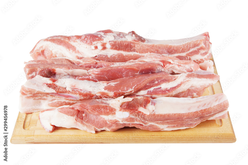 Pieces of fresh pork meat on a cutboard isolated on white background
