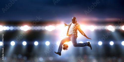 Soccer man in action with ball. Mixed media © Sergey Nivens