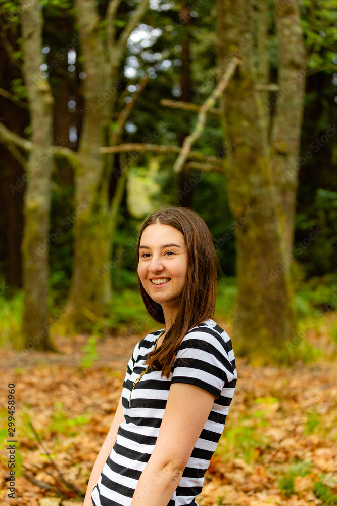 Young woman walking in parkland Young woman walking in parkland
