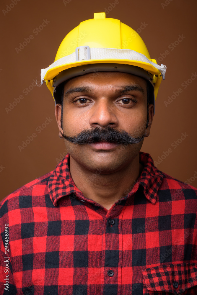 Face of Indian man construction worker with mustache Face of Indian man construction worker with mustache