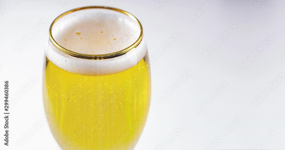 Close up of a cups of Stella Artois full of beer on a white background Close up of a cups of Stella Artois full of beer on a white background