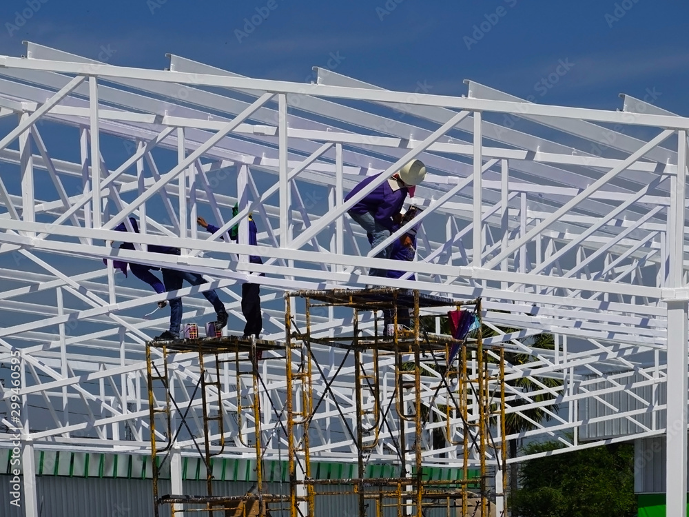 Workers painted the roof structure on the construction site