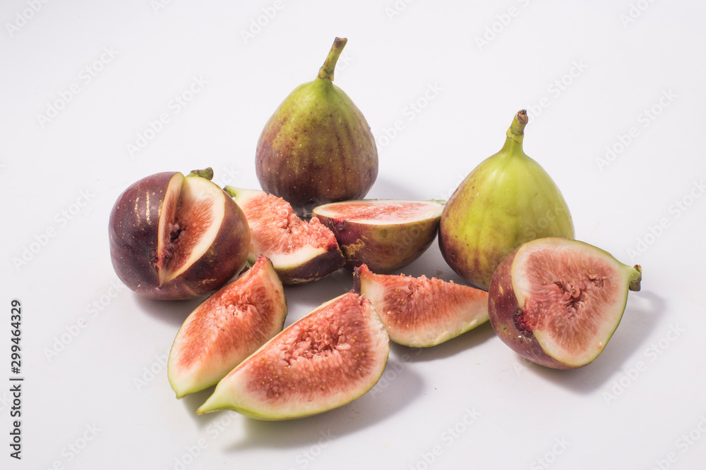 Fresh fig fruit half and quarter isolated Fresh fig fruit half and quarter isolated