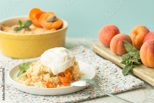 Crumble apricot pie on white table, morning dessert