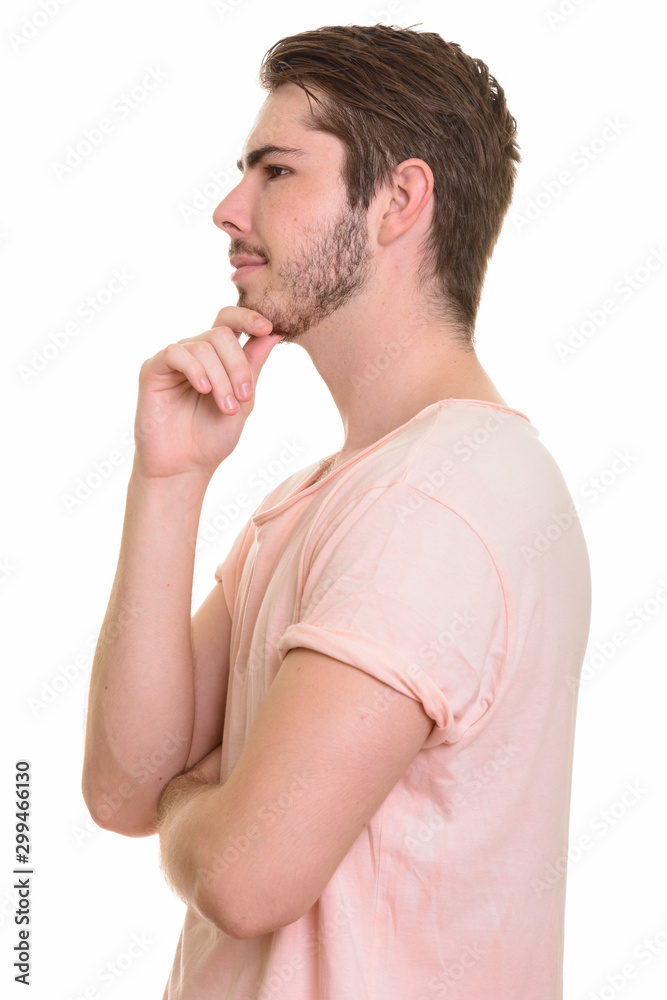 Profile view of young handsome bearded man Profile view of young handsome bearded man