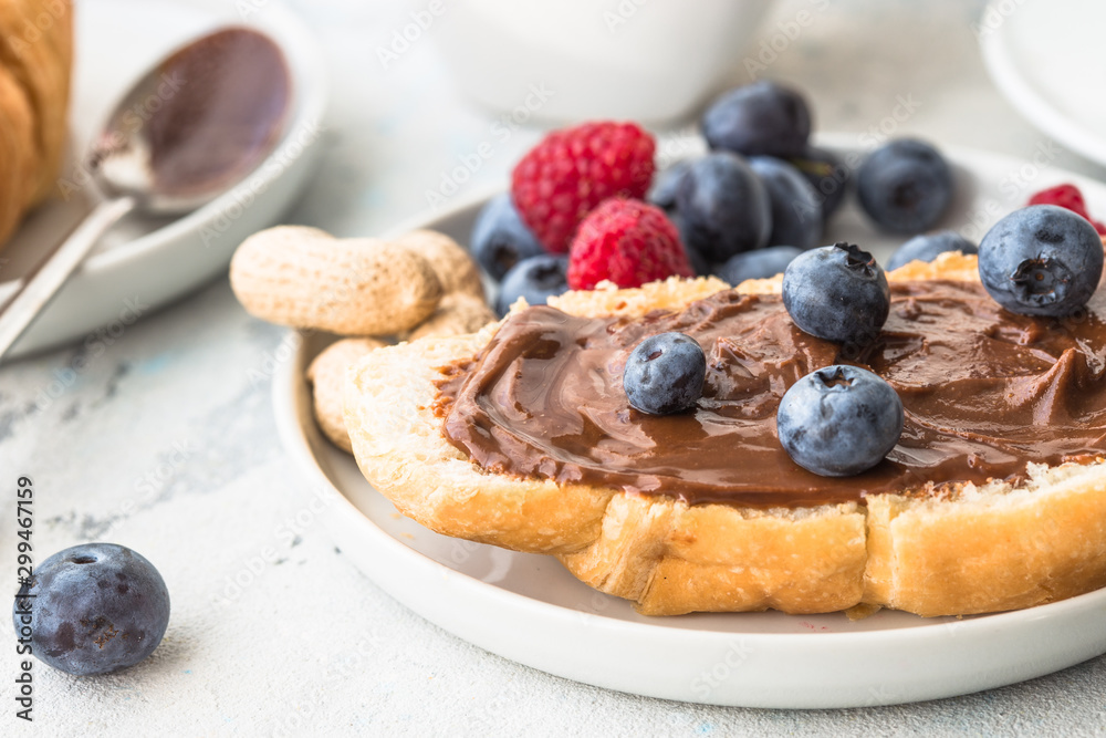 breakfast with croissants and berry, orange juice. fresh crispy croissants and coffee on a light background, top view/ breakfast with croissants and berry, orange juice. fresh crispy croissants and coffee on a light background, top view/