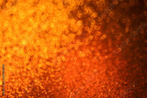 bokeh lights background in orange color with blur.
