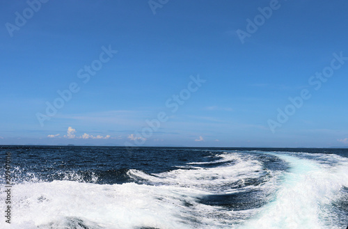boat ride on the sea, exotic James Bond islands against the blue sea, waves of spray in Thailand