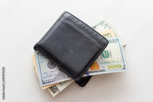 Wallet with cash paper dollars on a white background. Business profit concept