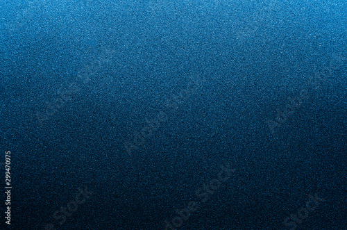 Dark blue underwater glittering glowing metallic background.