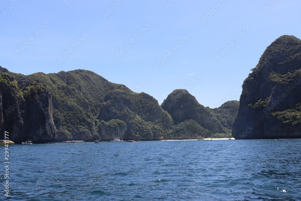 boat ride on the sea, exotic James Bond islands against the blue sea, waves of spray in Thailand boat ride on the sea, exotic James Bond islands against the blue sea, waves of spray in Thailand