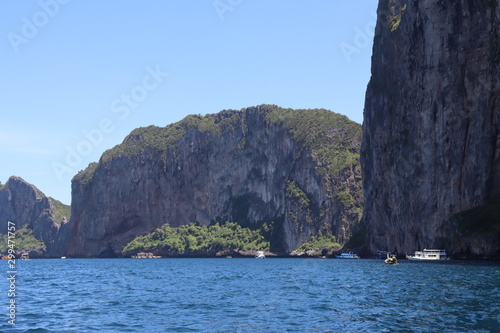 boat ride on the sea, exotic James Bond islands against the blue sea, waves of spray in Thailand
